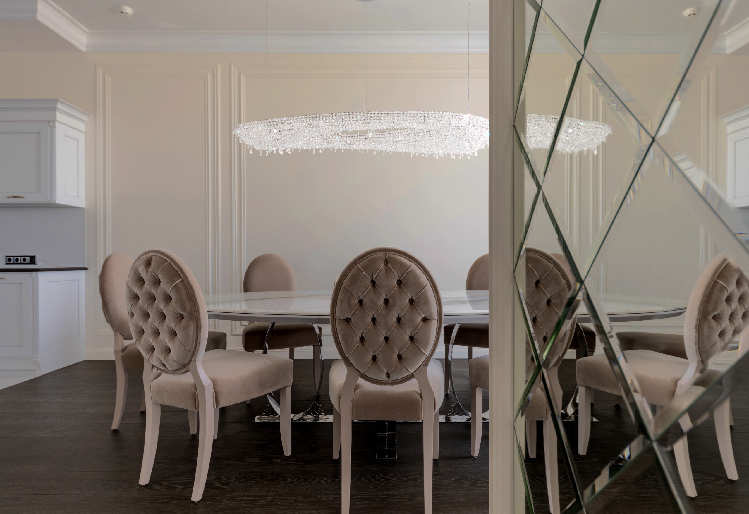 Artica chandelier above a dining table 
